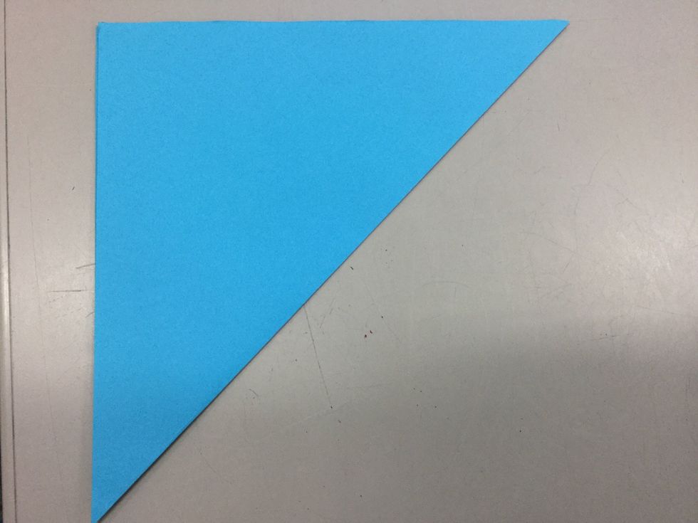 Step 1: Fold the paper diagonally point to point.