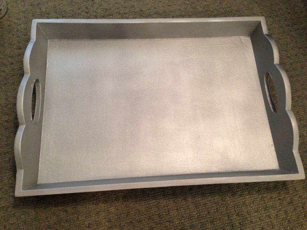 Step 1: lightly sand tray so paint will adhere. Step 2: cover paint with one to two layers of primer (optional). Step 3: spray several layers of first paint color until covered evenly (I chose silver)