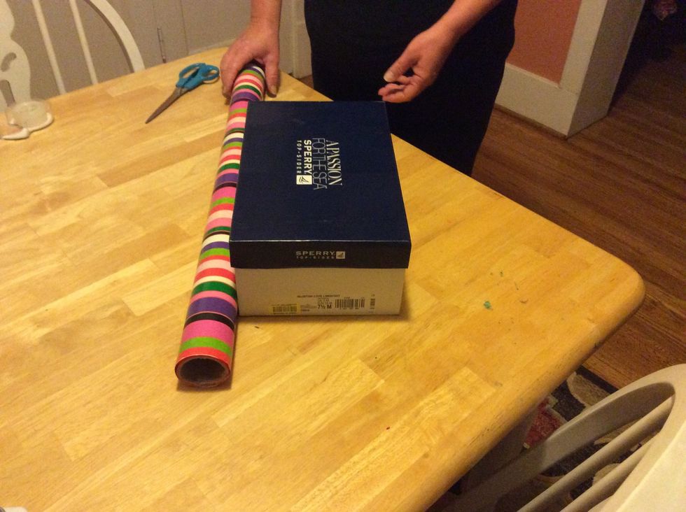 Step 1: Measure your wrapping paper so it lines up to the middle of the present.