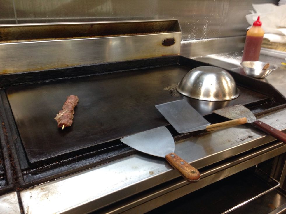 Step 1:Place lamb skewer on heated grill.