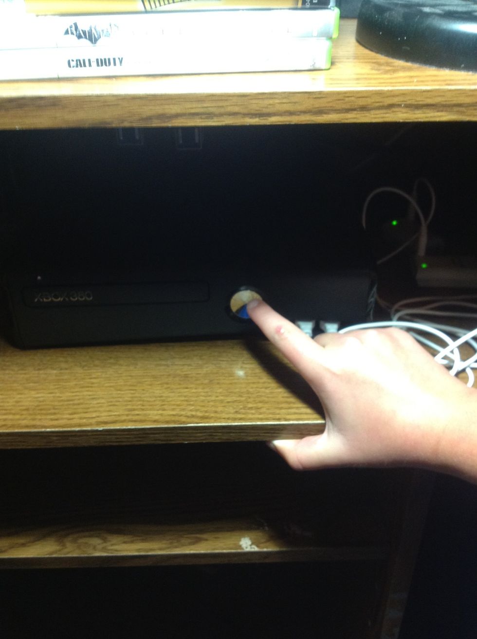 Step 1: Turn on the Xbox by pressing the power button.