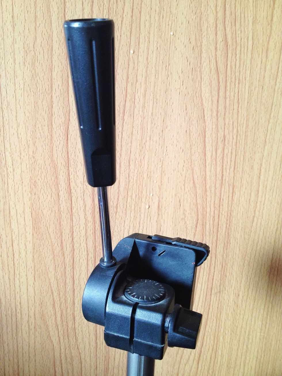 Step 1: Turn the handle of the tripod 90 degrees