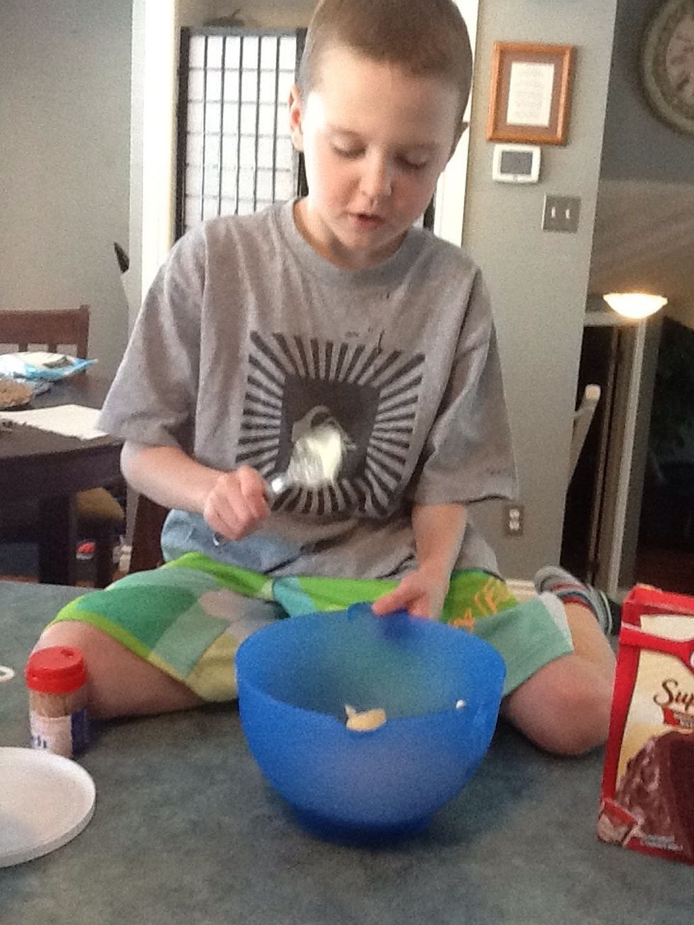 Step 10: Add 6 tablespoons of butter into the icing mixture.