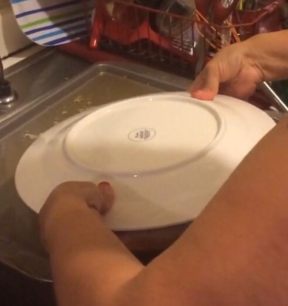Step 10: Put a flat plate on top of the baking dish and with both hands grab both the plate and the baking dish. Carefully AND quickly flip the flan over to where the flat plate is now on the bottom