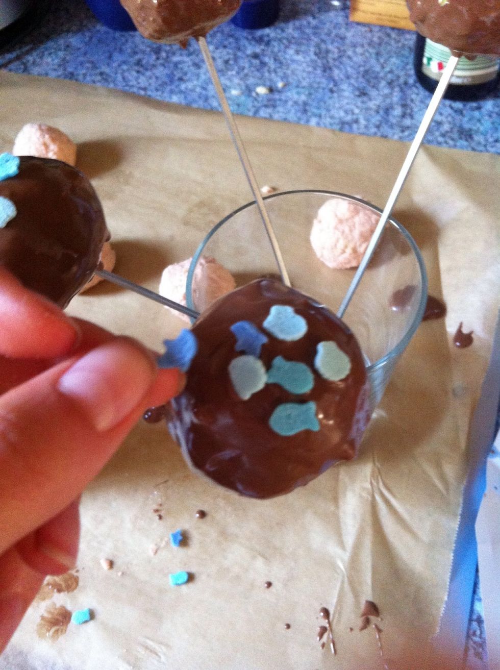 Step 10: while the chocolate is still a little soft decorate the cake pops with any decoration you like.