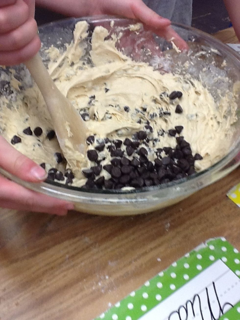 Step 11 Add 2 cups of Hershey's Special Dark Chocolate Chips and stir with wooden spoon.