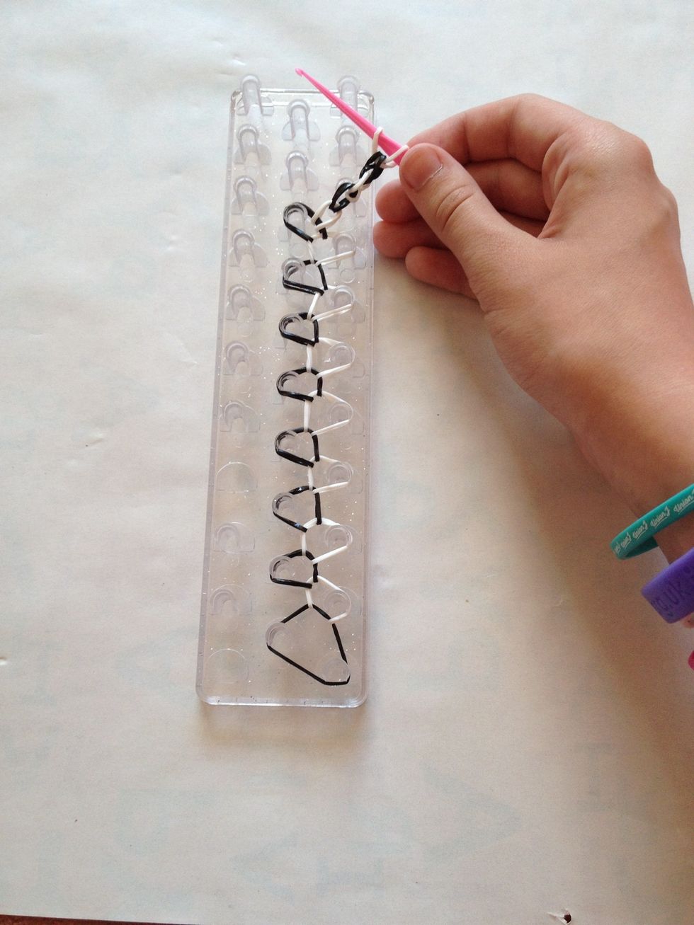 Step 11: carefully pull your bracelet off keeping the hook through the last band