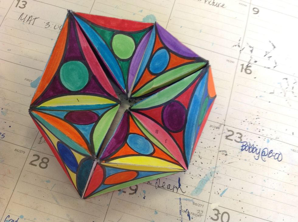 Step 11: Slide the last tab on one end into the slot on the other end to create a hexagon.