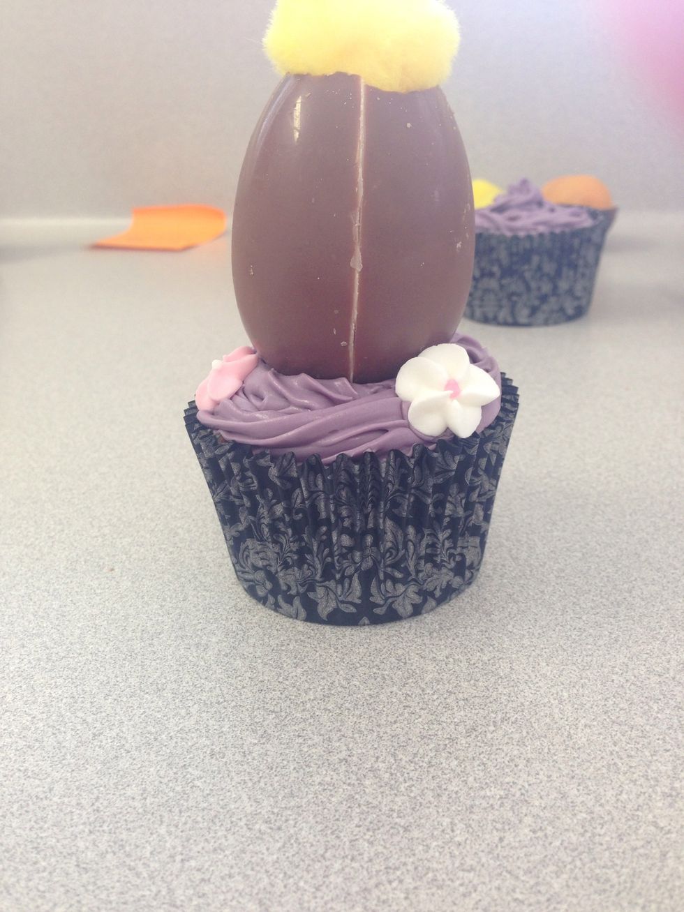 Step 12. And place around the cupcake making sure there is an even amount on the cupcake in this case two white and two pink.