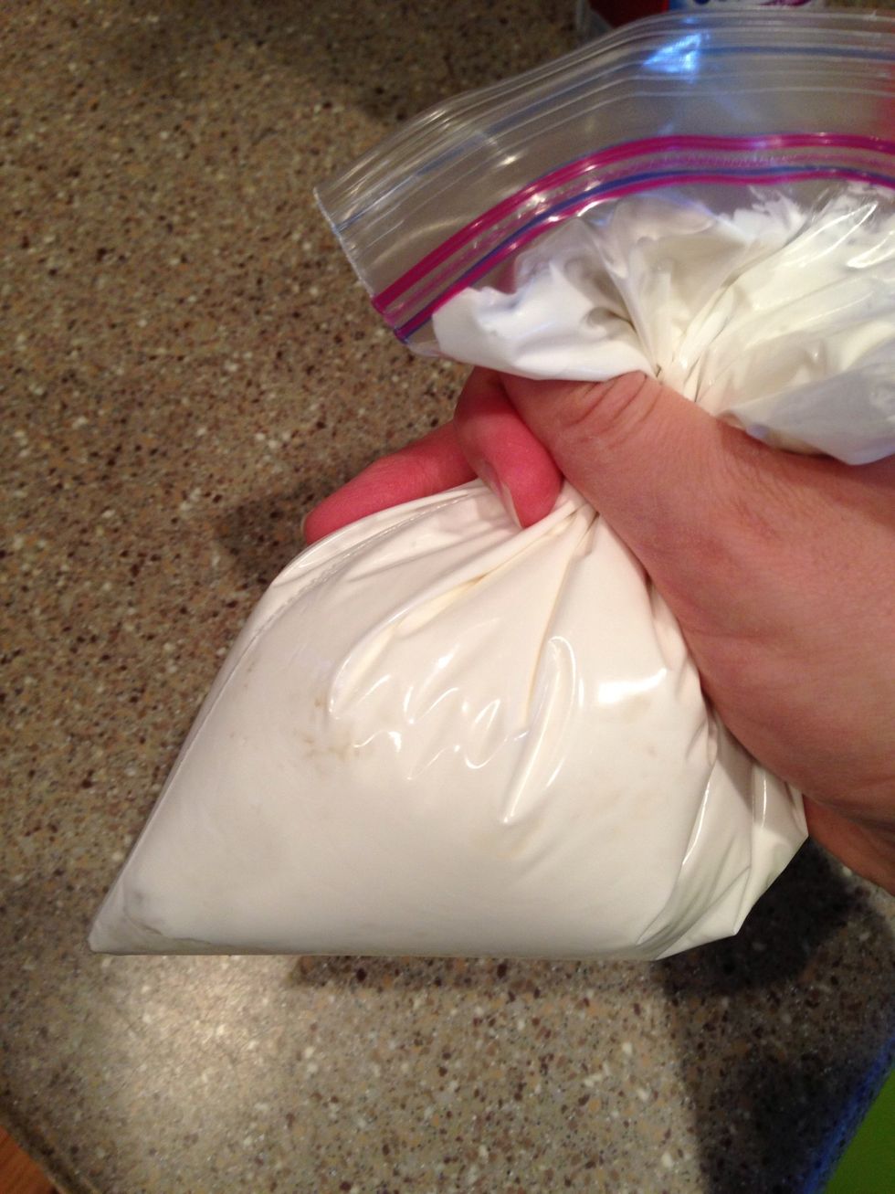 Step 12: squeeze the icing to one corner of the bag and cut the tip.