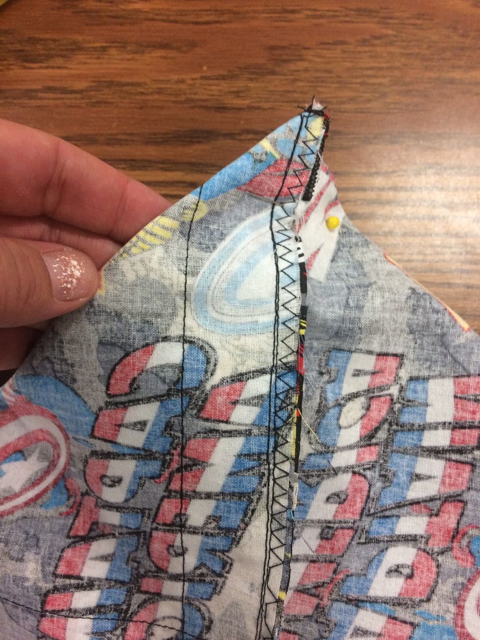 Step 14. To make bottom flat, make a dart or triangle on each bottom corner. (See instructions for details) pin in place.