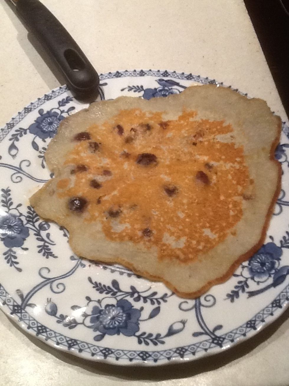 Step 14: Use a spatula to flip the pancake onto a plate.