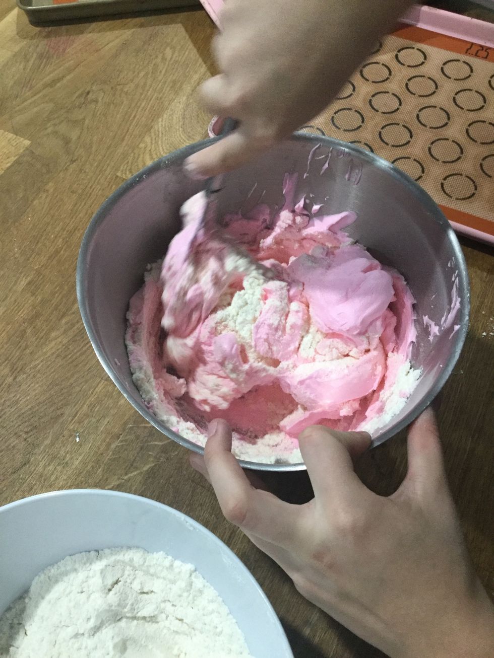 Step 15: Continue doing this and turn the bowl each time until the meringue has been incorporated.