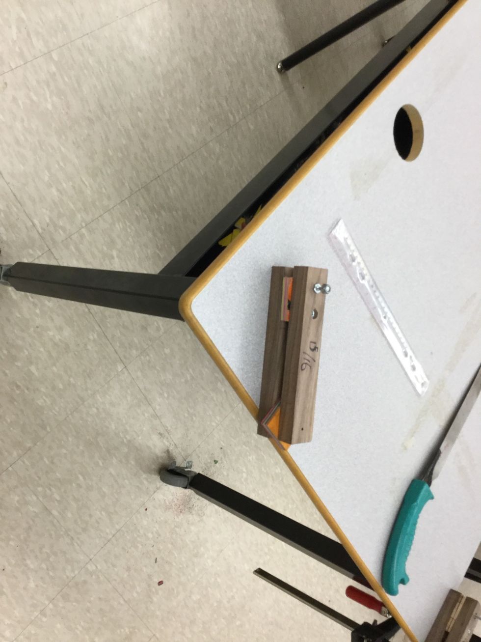 Step 16: clamp down the glued veneers and then get a knife, make sure you don't cut yourself though.