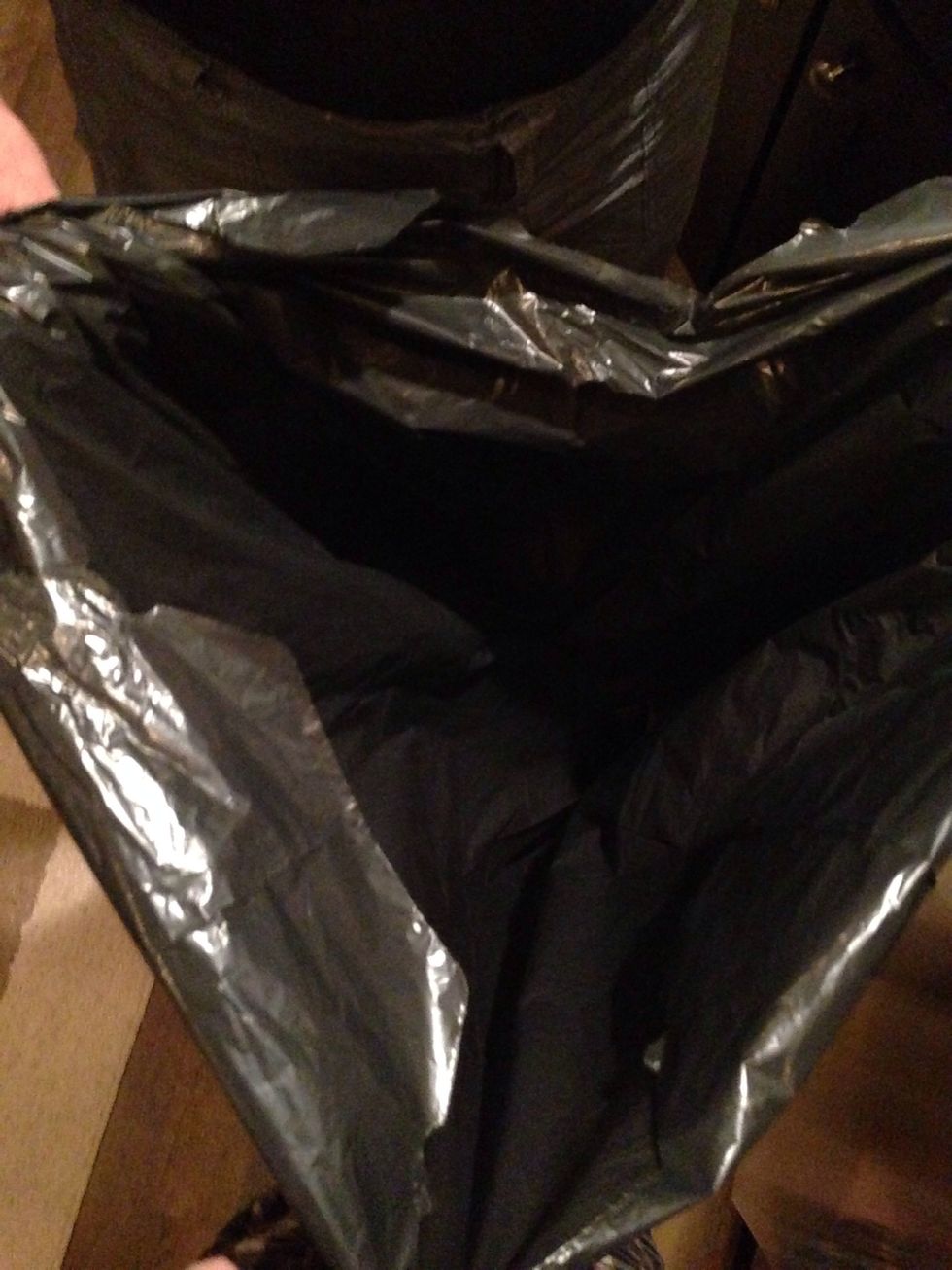 Step 17: Get your kitchen trash bag and open it up.