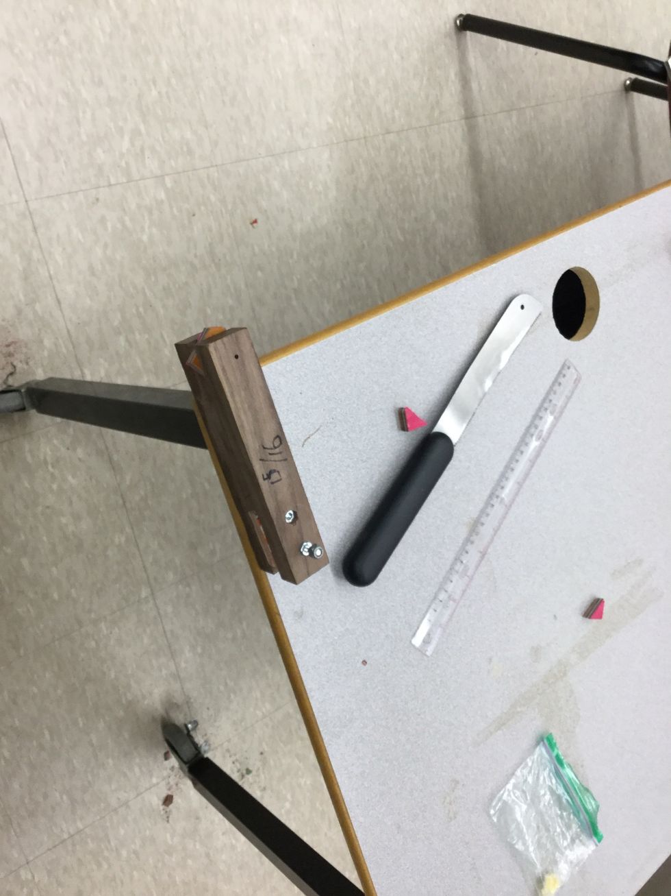 Step 17: Use the knife and cut the chunk of veneers corners off. Make sure to turn it after your done cutting off each corner.