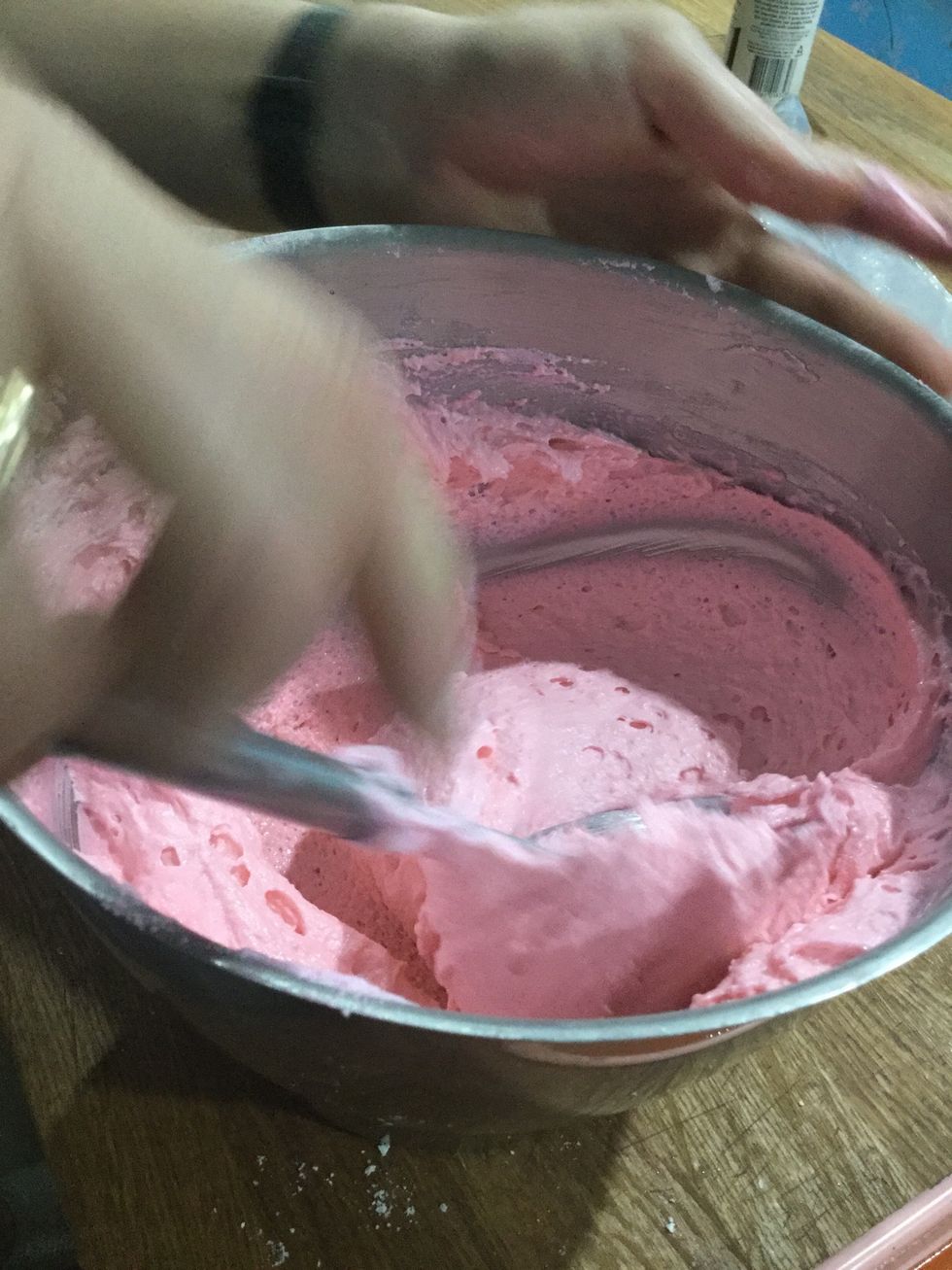 Step 17: When the mixture starts to look glossy, test the batter by lifting the spatula up over the bowl.