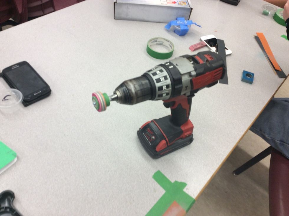 Step 19: put the drill bit in the drill, the tape down the sandpaper, and your all set to go