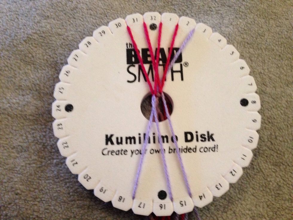 STEP 19 - This is where the cross starts to form again. Bring thread 29 down and over to slit 15.