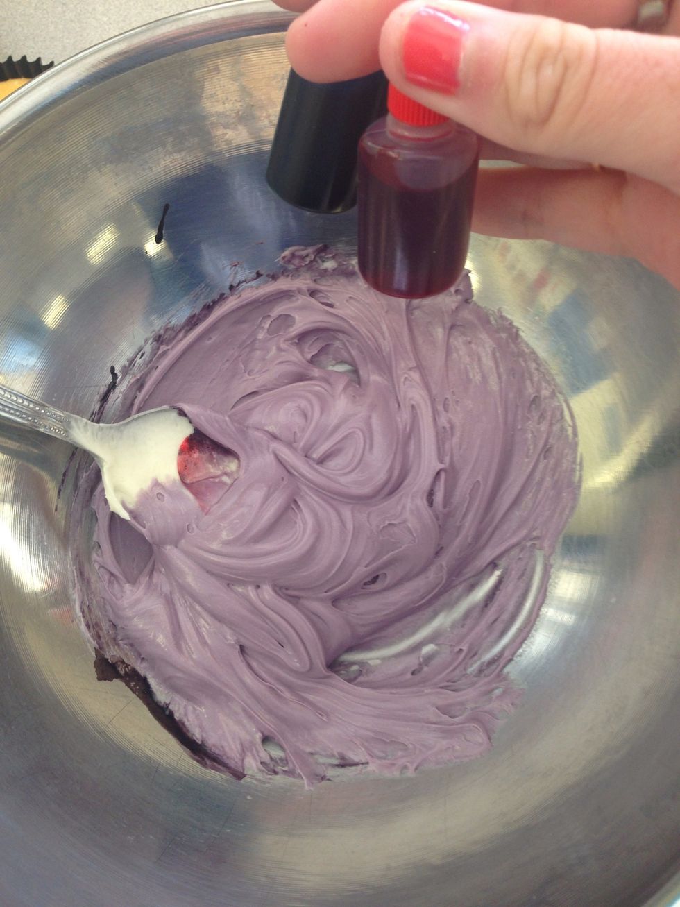 Step 2. Add food colouring, in this case we are making purple icing, mix blue and red icing to make the purple you want.