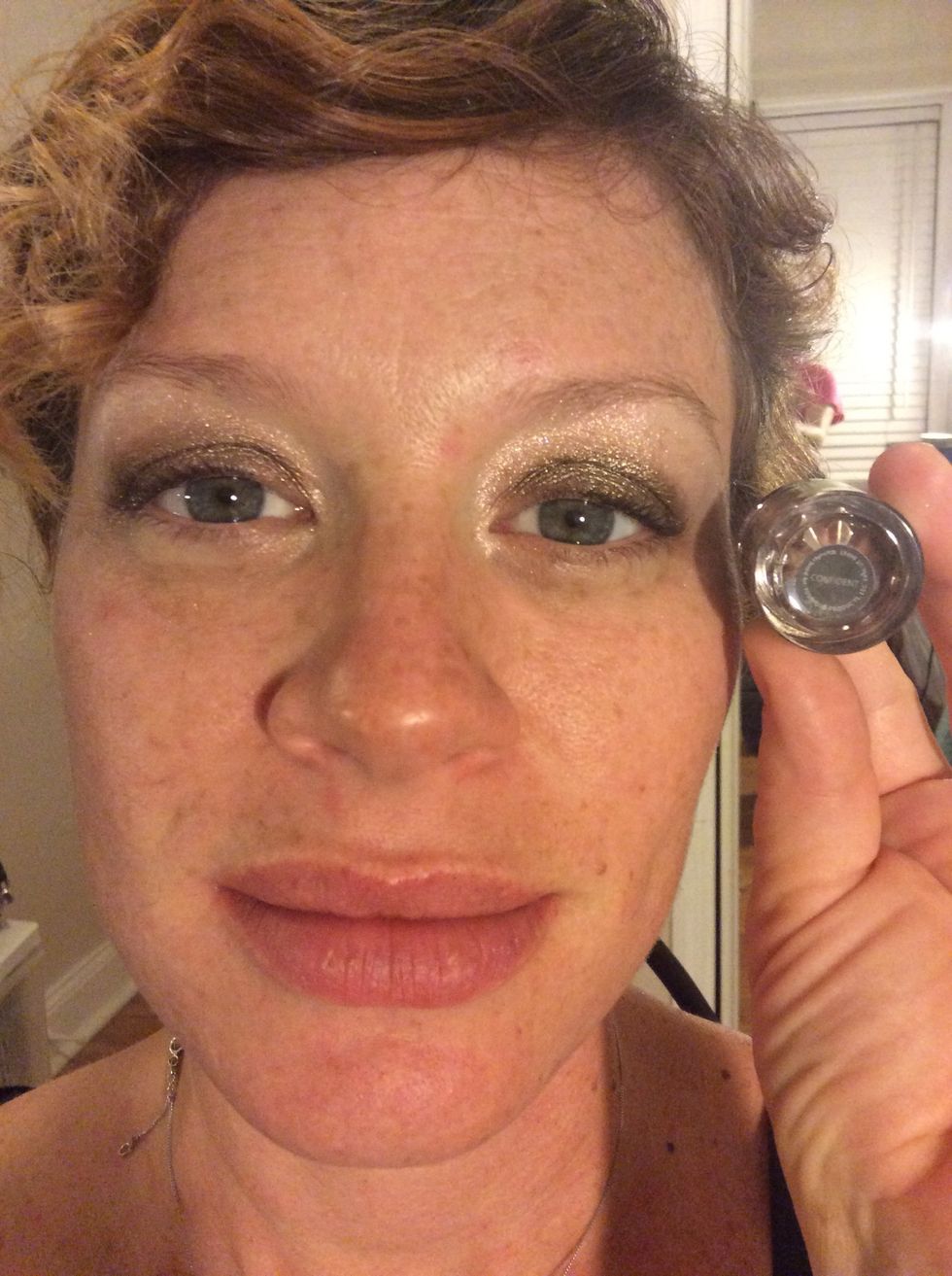 Step 2: Apply Younique's shimmer pigment Curious mixed with Younique's Rose Water to the lid and a little above the crease