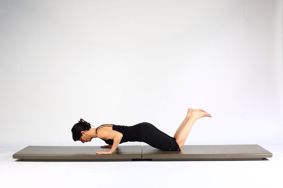 STEP 2 Bend elbows and lower breast bone and pubic bone at the same time. Only go as low as you can keep good form. Pay attention that you keep the head in lune with spine not dropped forward.