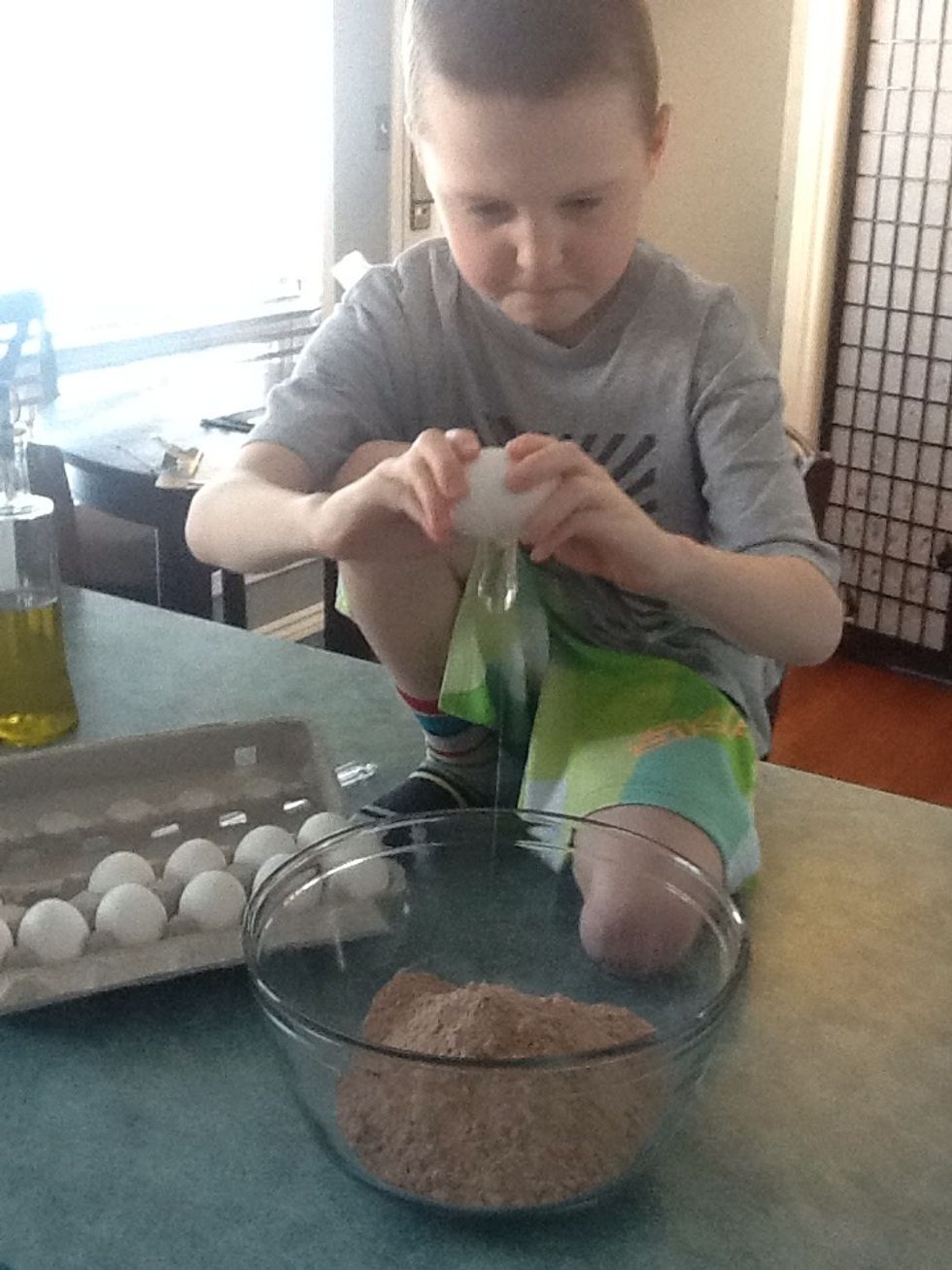 Step 2. Crack three eggs into the Betty Crocker mix.