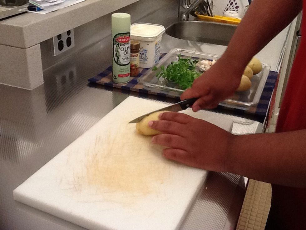 Step 2. Cut potatoes in half then cut again in half