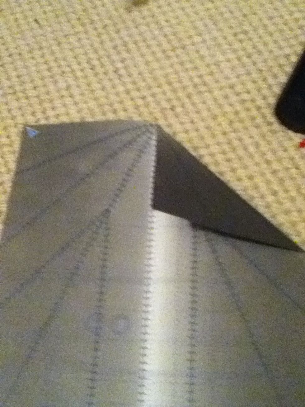Step 2: fold down a corner into the middle