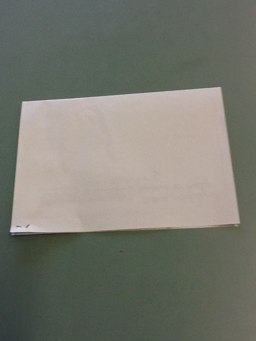 Step 2 Fold your piece of paper in half like it has been done on the picture