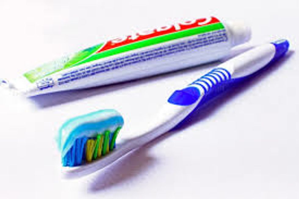 step.2:next open your tooth paste and put a Little bit on your tooth Brush