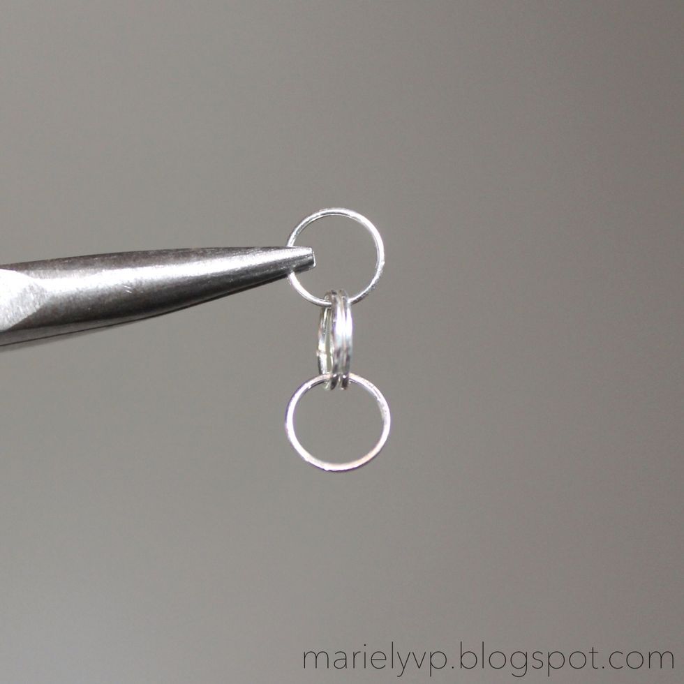 Step 2: open one jump ring and insert two jump rings. Then, add another jump ring at the end as shown in the photo.