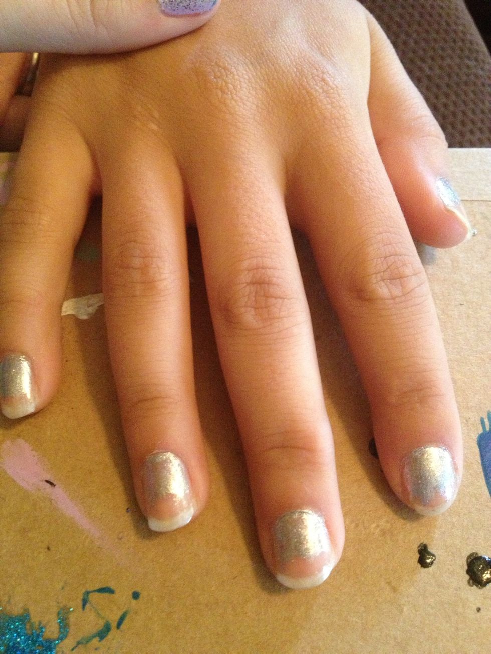 Step 2: Paint bottom half of nails with silver nail polish