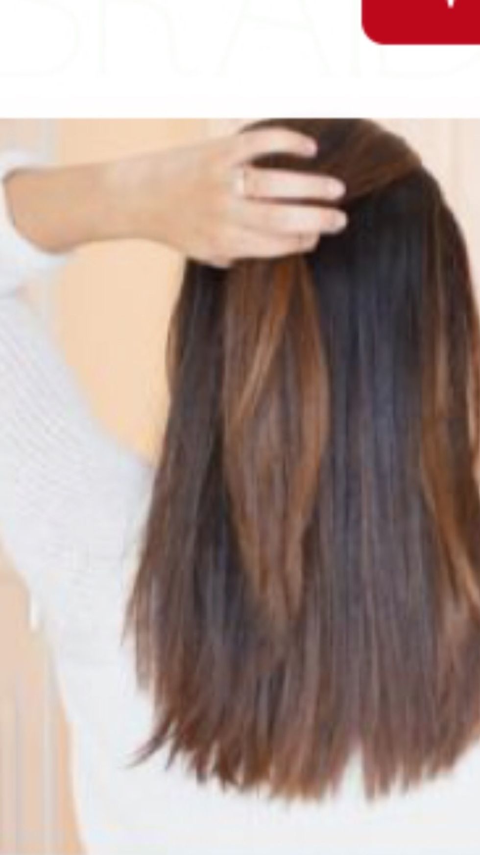 Step 2: Part the hair straight down the middle to ensure an even braid. Then grab a small front portion of hair as shown in the picture.