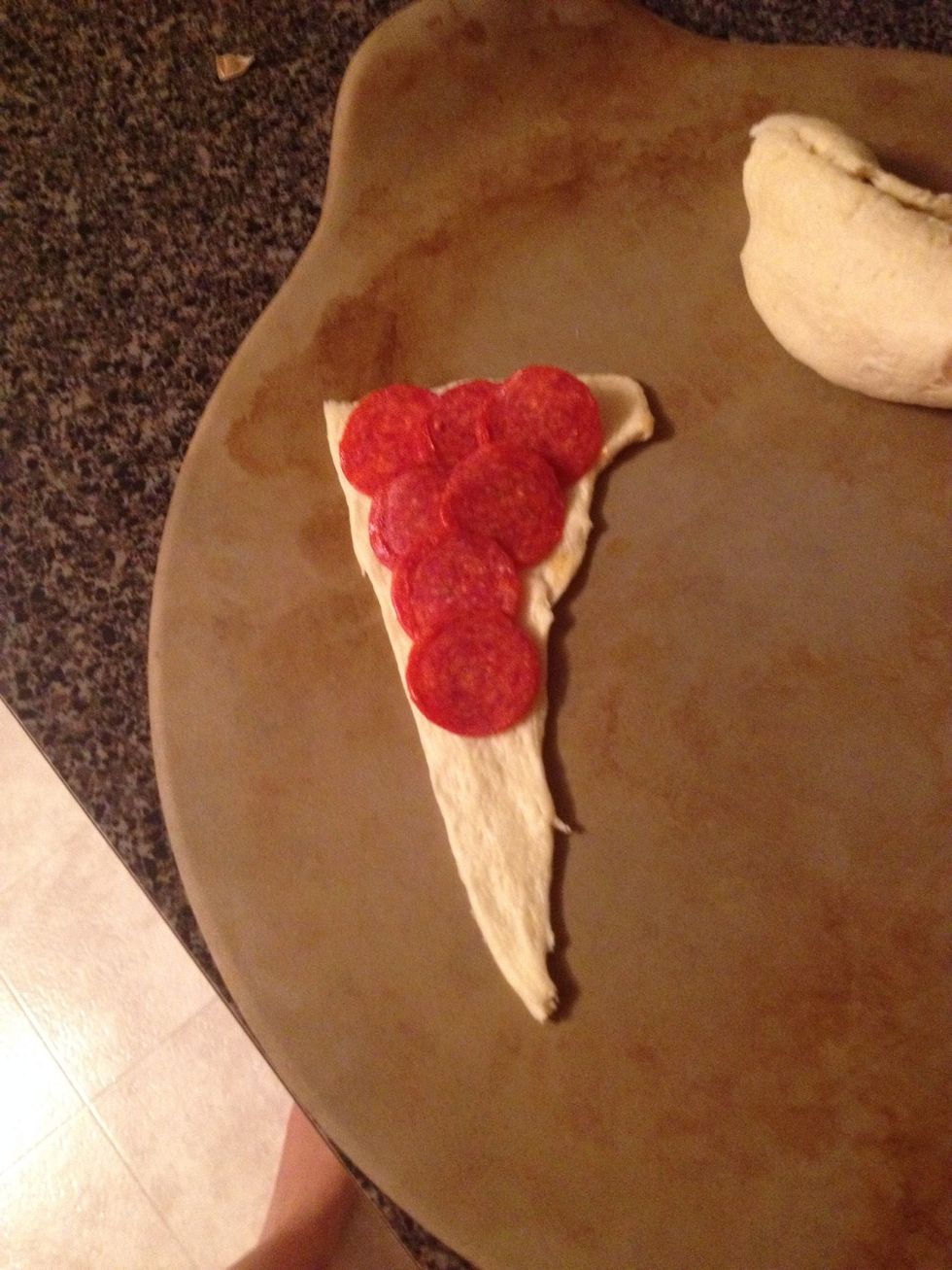 Step 2: Place pepperonis on crescent roll.