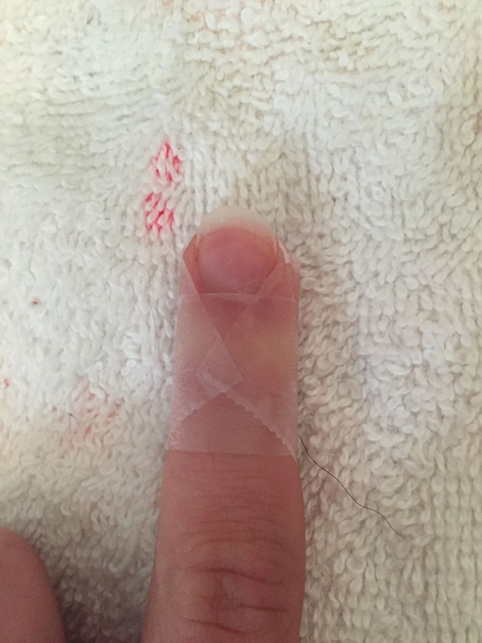 Step 2: Place tape around nail bed.