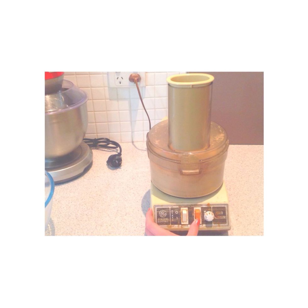 Step 2. Put 110 g of plain sweet biscuits in the food processor till crushed.