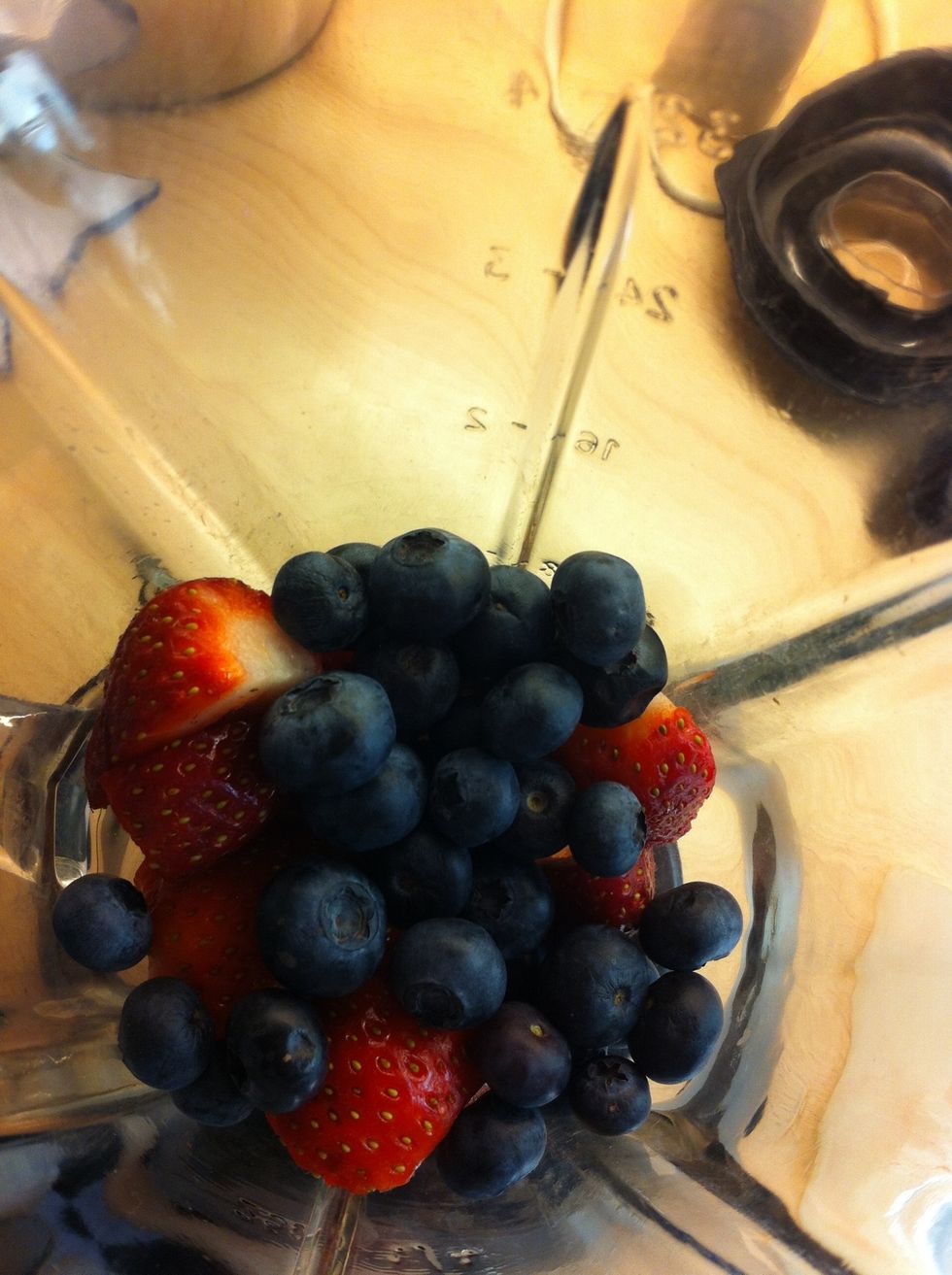 Step 2: put the strawberrys and blueberrys In the blender
