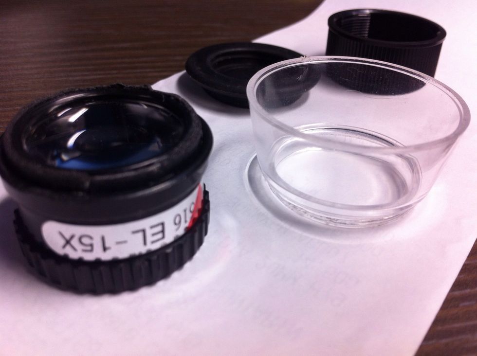 step 2  Split the hood lens of magnifier lens and clean up the lens using  smooth cloucth