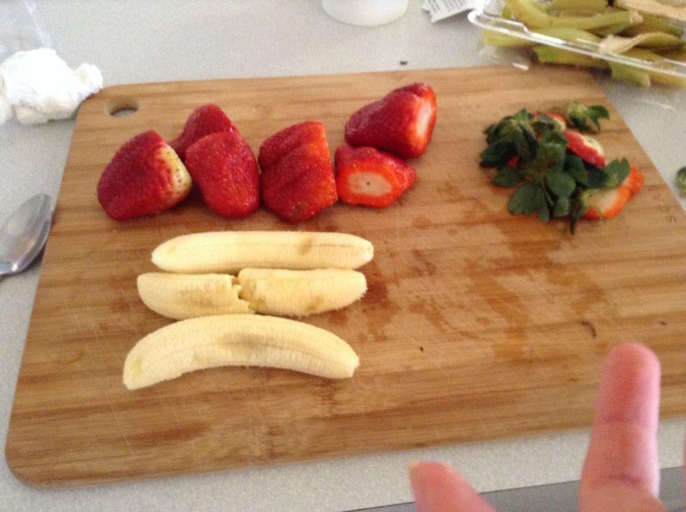 Step 2.Start off by pealing your banana and removing your\u00a0 strawberries leaves.