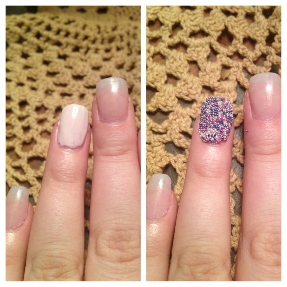 Step 2: Start with ring finger and paint nails with polish. I used the light pink polish that came with my kit. Before the nail dries, dump beads on to the wet polish.