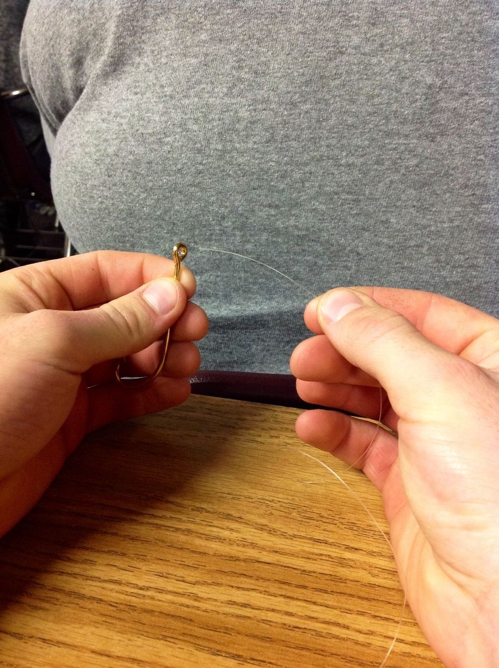 Step 2: Take the hook in your left hand a the line in your right hand