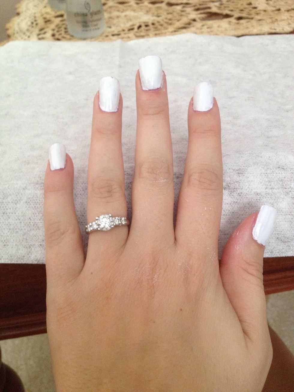 Step 2: Use white nail polish to paint one base coat on nails and let dry