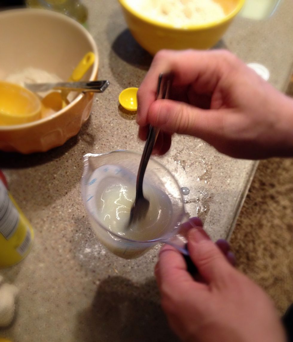 Step 2: Using a fork, mix together oil and milk.