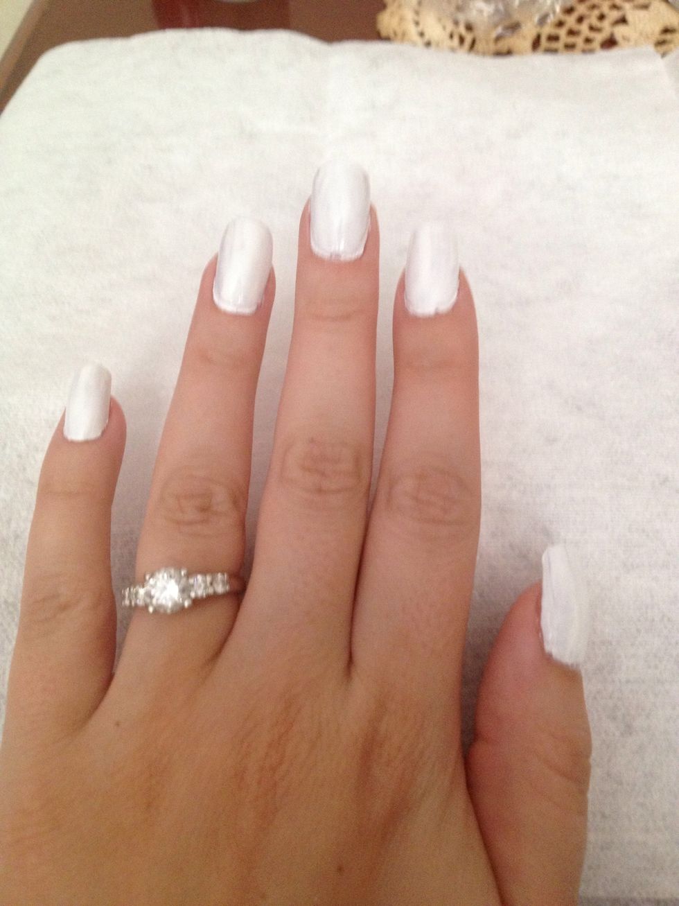 Step 2: Using the lighter nail polish coat, paint one layer on nails and let dry