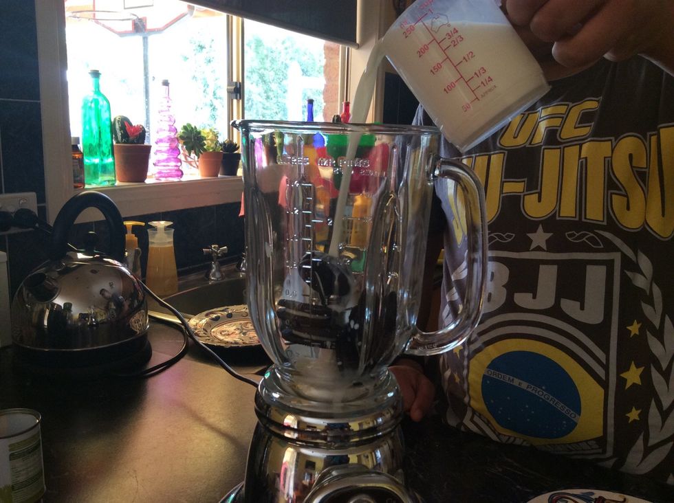 Step 2: Using the measuring cup, fill the cup with Milk and pour it in the blender. Be careful when you fill the measuring cup.