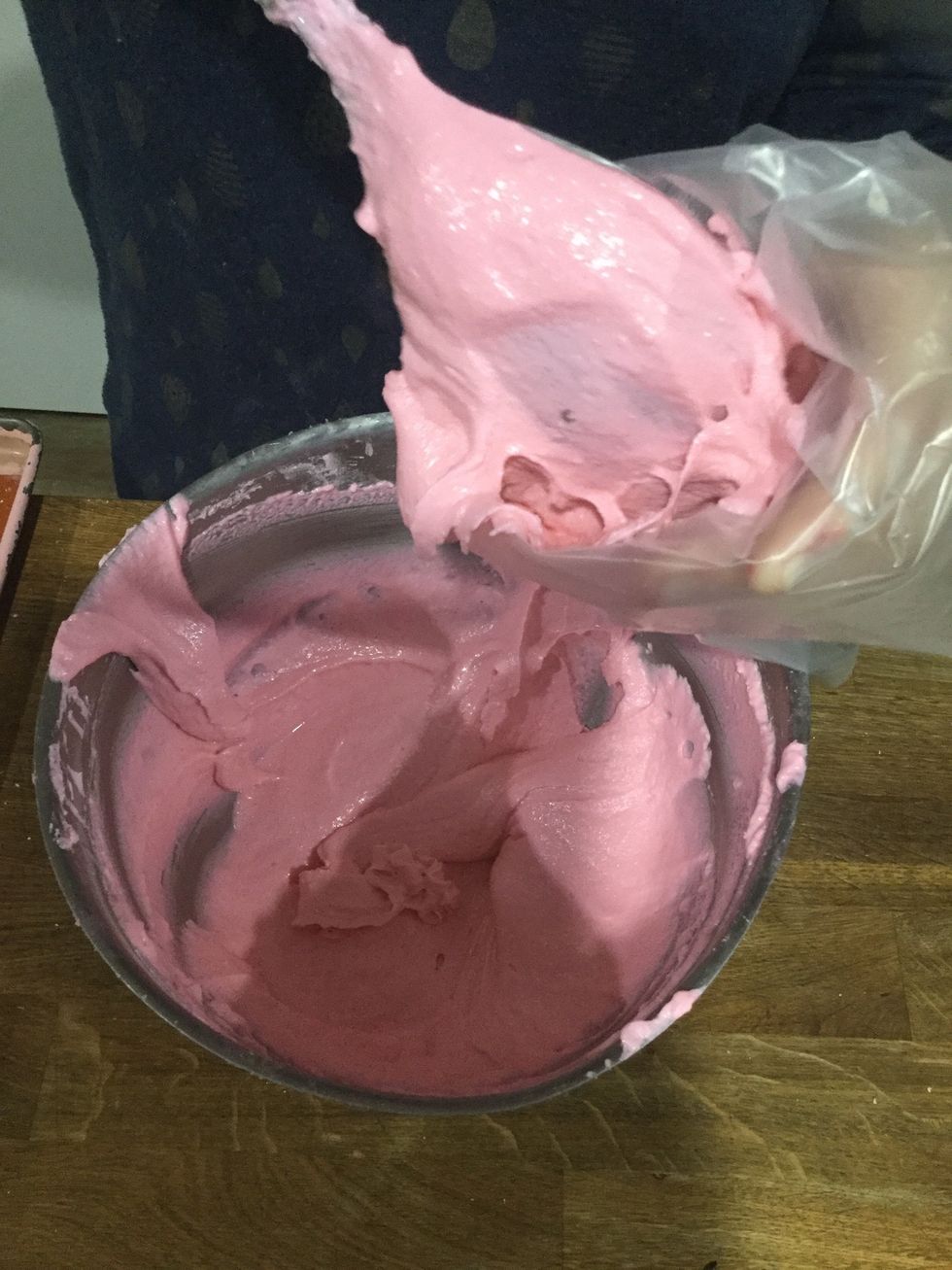 Step 21: Once the batter is at the right consistency, transfer it into a piping bag fitted with a round tip.