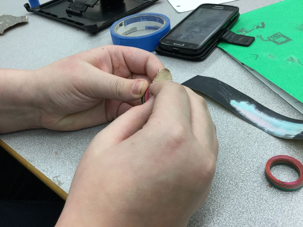 step 22: then if you have nicks in your ring then sand them off to make it more of a ring and less of getting your finger caught in the ring.