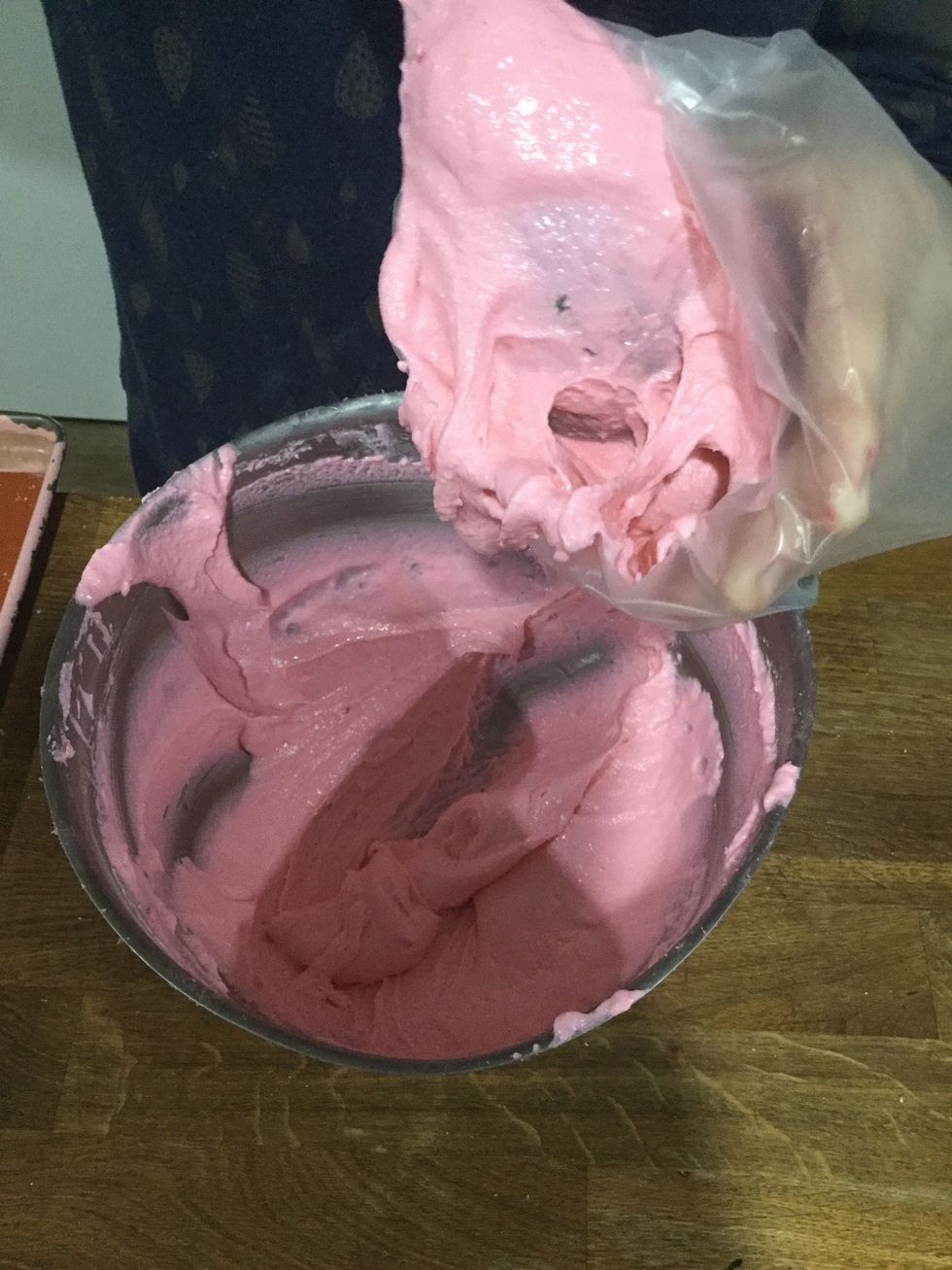 Step 22: You can make this process easier by folding the bag over a tall glass and then scooping the batter in.