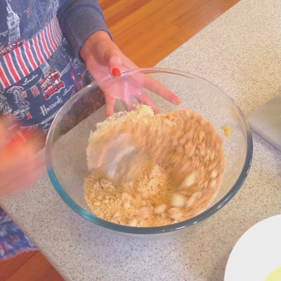 Step 3. After taking out the crushed biscuits, add the butter and almond meal.